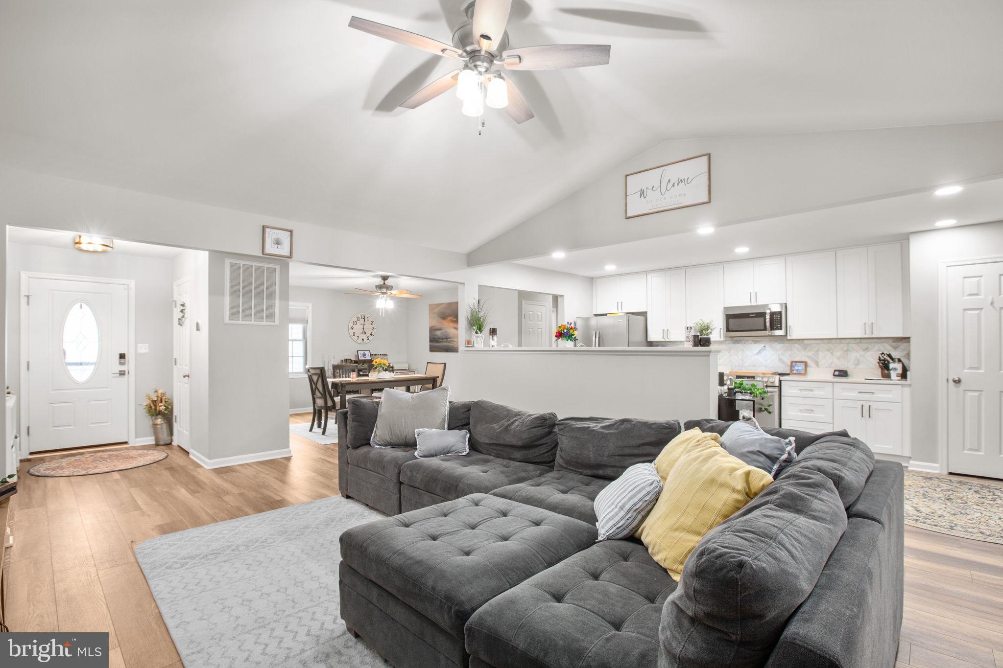 114 Saylers Creek Road Locust Grove, VA 22508 - Photo 7 of 32 a living room with furniture and kitchen view