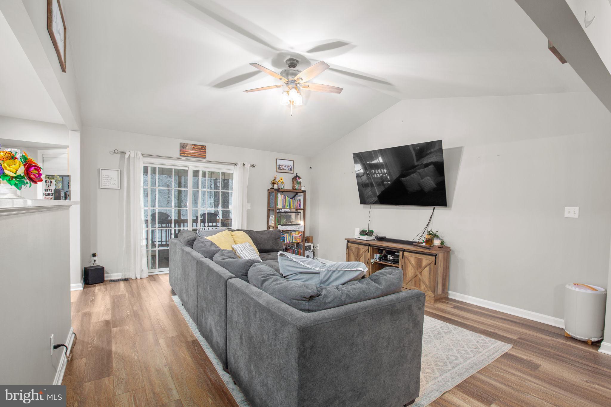 114 Saylers Creek Road Locust Grove, VA 22508 - Photo 8 of 32 a living room with furniture and a flat screen tv