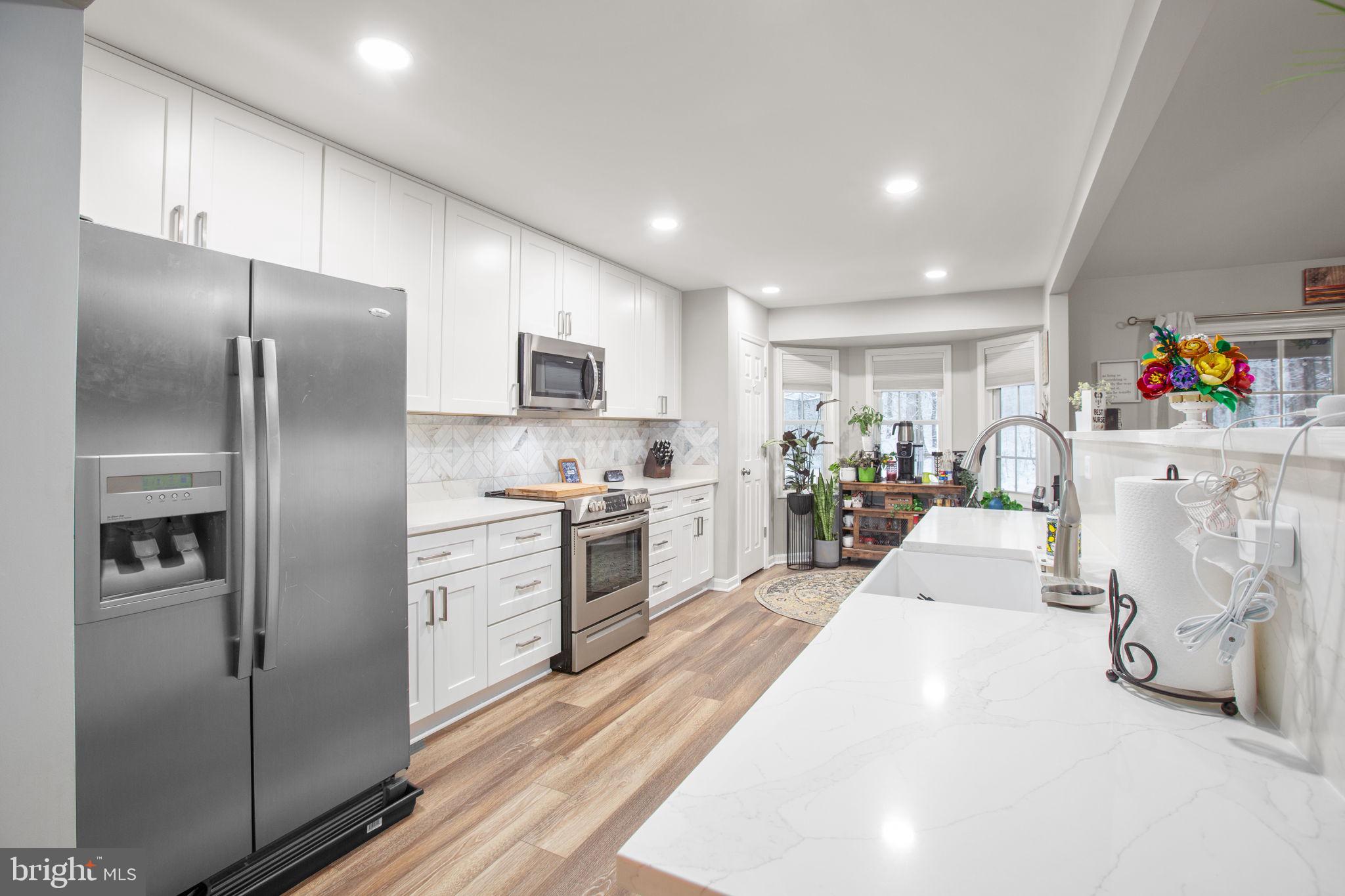 114 Saylers Creek Road Locust Grove, VA 22508 - Photo 10 of 32 a kitchen with stainless steel appliances a refrigerator sink and a cabinets