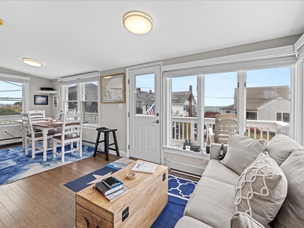 35 Cliff Road South Scituate, MA 02050 - Photo 15 of 42 a living room with furniture a rug potted plant and a large window