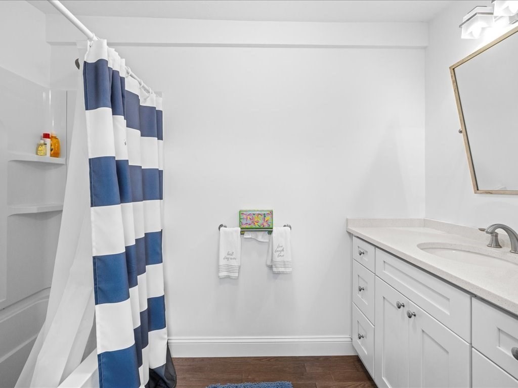 35 Cliff Road South Scituate, MA 02050 - Photo 21 of 42 a bathroom with a sink and a mirror