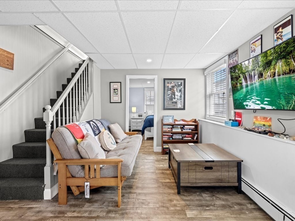 35 Cliff Road South Scituate, MA 02050 - Photo 23 of 42 a living room with furniture and a flat screen tv