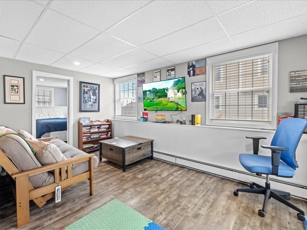 35 Cliff Road South Scituate, MA 02050 - Photo 24 of 42 a living room with furniture a window and a flat screen tv