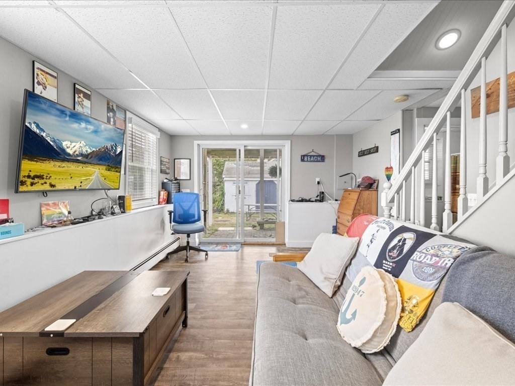 35 Cliff Road South Scituate, MA 02050 - Photo 25 of 42 a living room with furniture and a flat screen tv