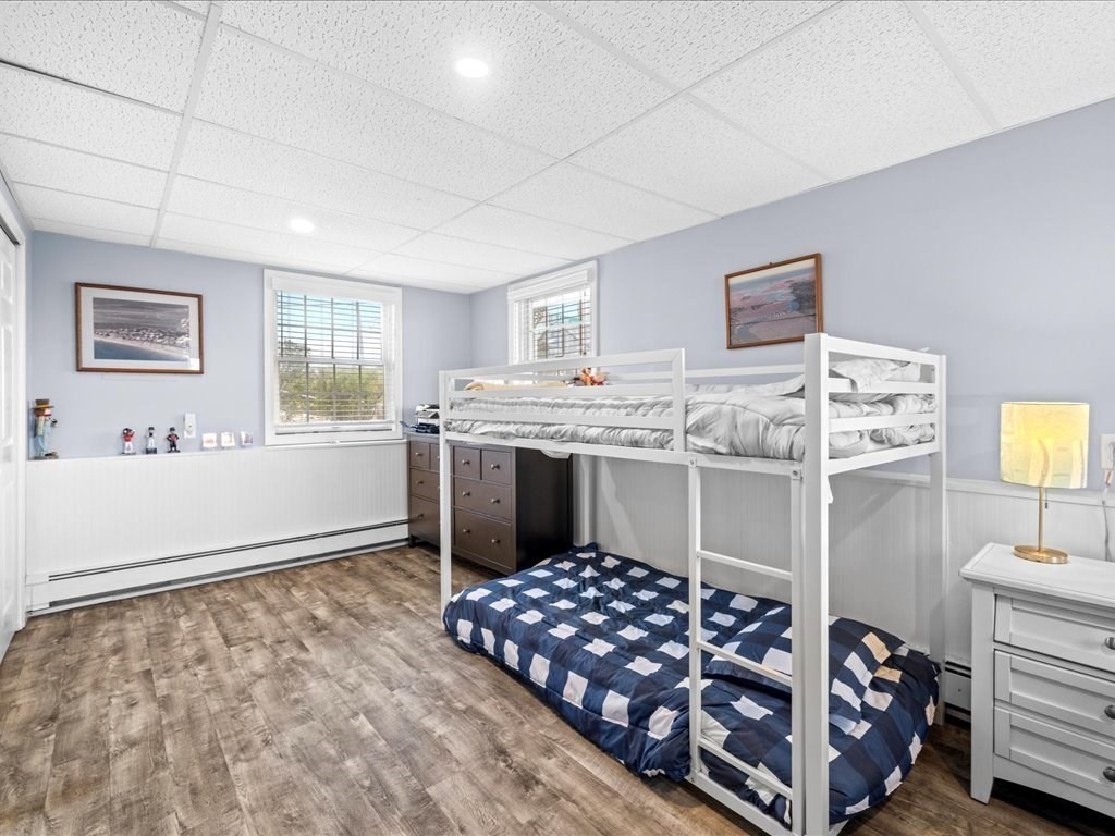 35 Cliff Road South Scituate, MA 02050 - Photo 27 of 42 a bedroom with a bed and cabinets