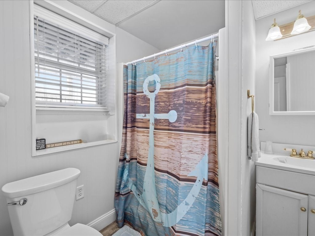 35 Cliff Road South Scituate, MA 02050 - Photo 28 of 42 a bathroom with a shower toilet and sink