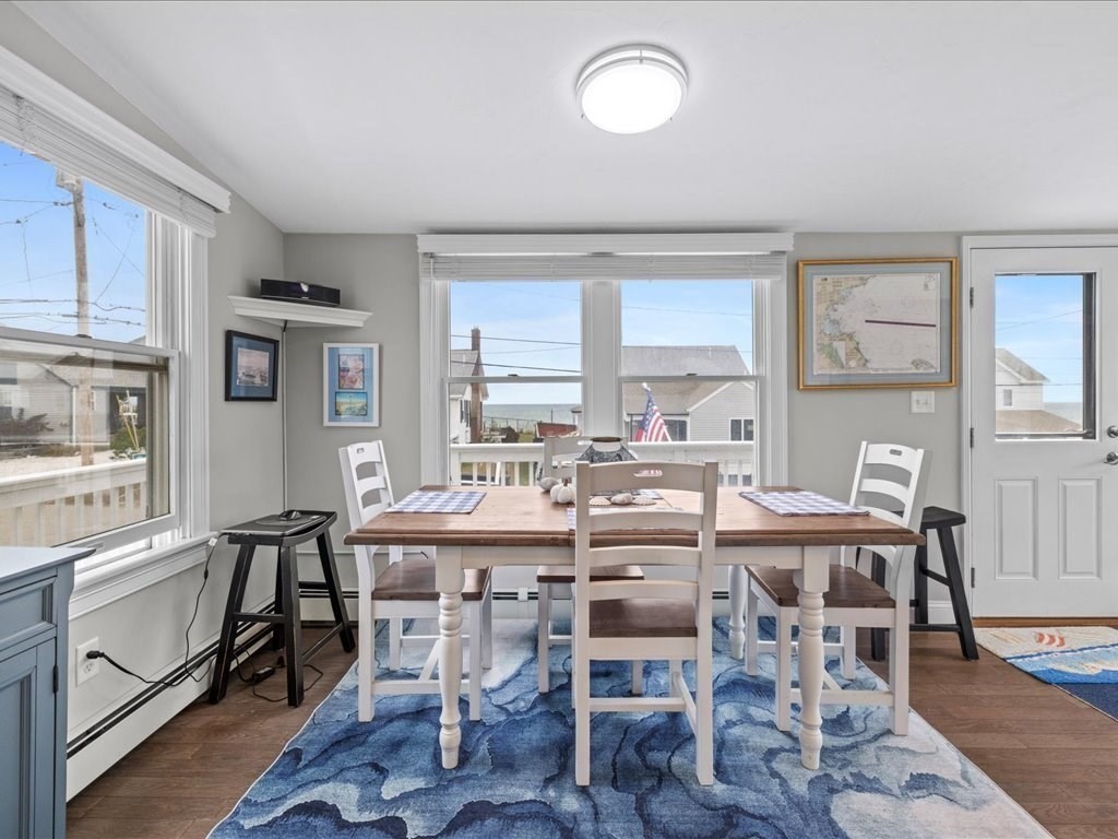 35 Cliff Road South Scituate, MA 02050 - Photo 10 of 42 a view of a dining room with furniture window and wooden floor