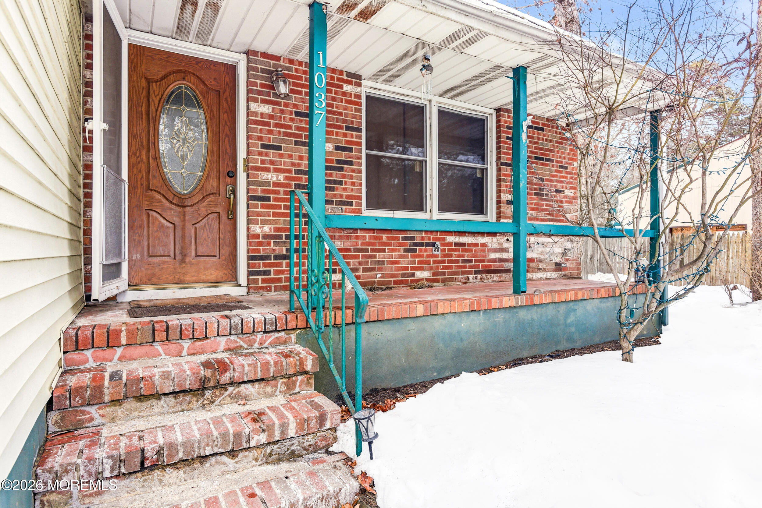 1037 Toms River Road Jackson, NJ 08527 - Photo 2 of 9 a front view of a house with garden