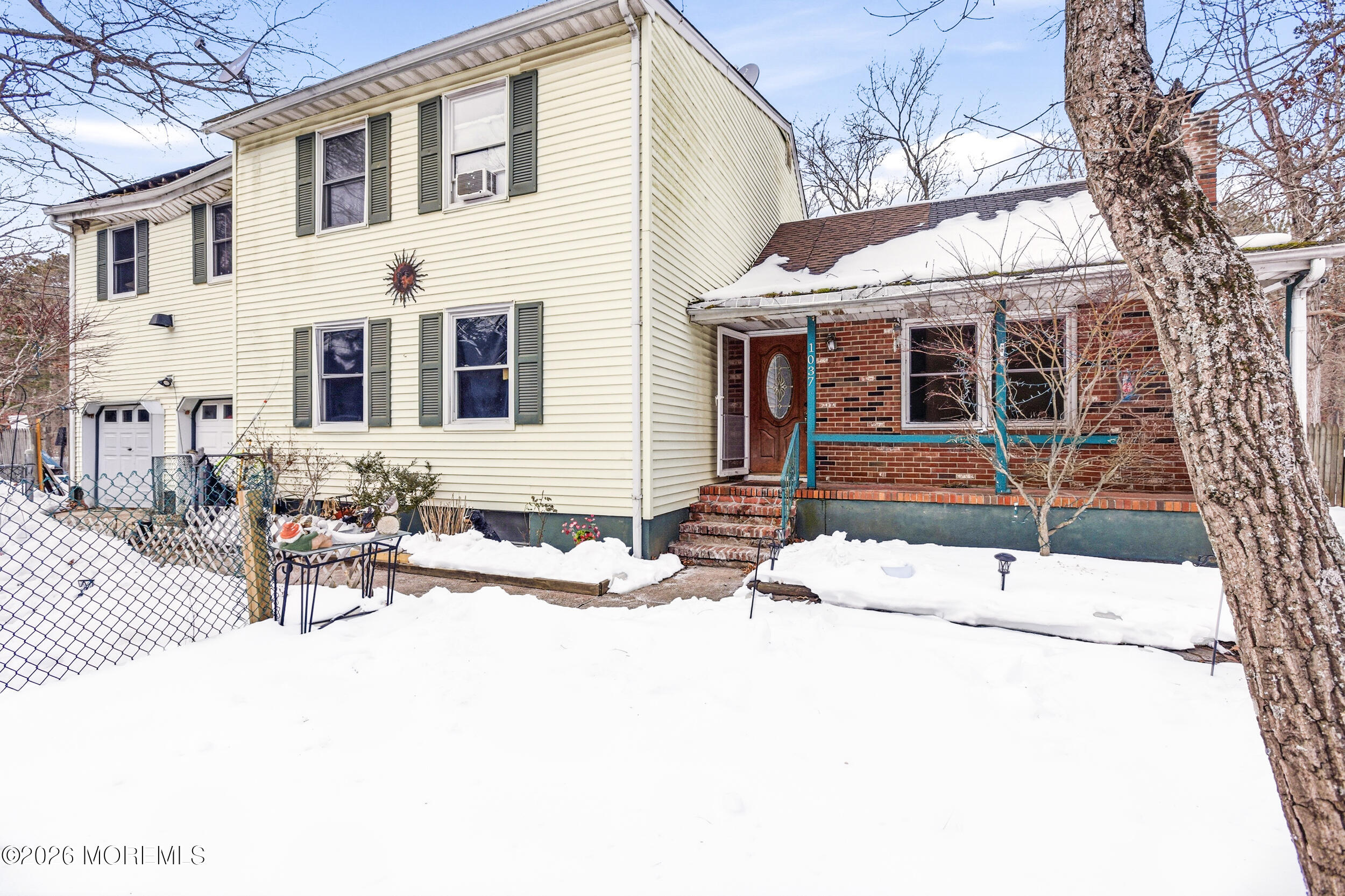 1037 Toms River Road Jackson, NJ 08527 - Photo 5 of 9 a patio with a table and chairs and potted plants