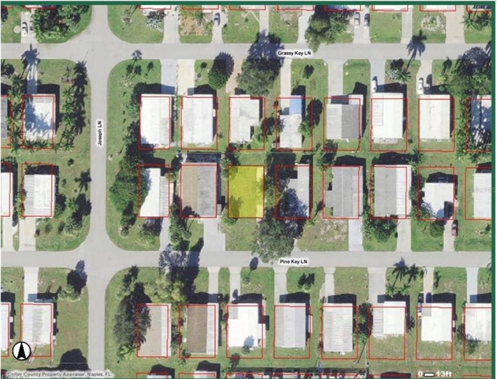 171 Pine Key Lane, Unit 28 Naples, FL 34114 - Photo 1 of 8 front view of building with small garden