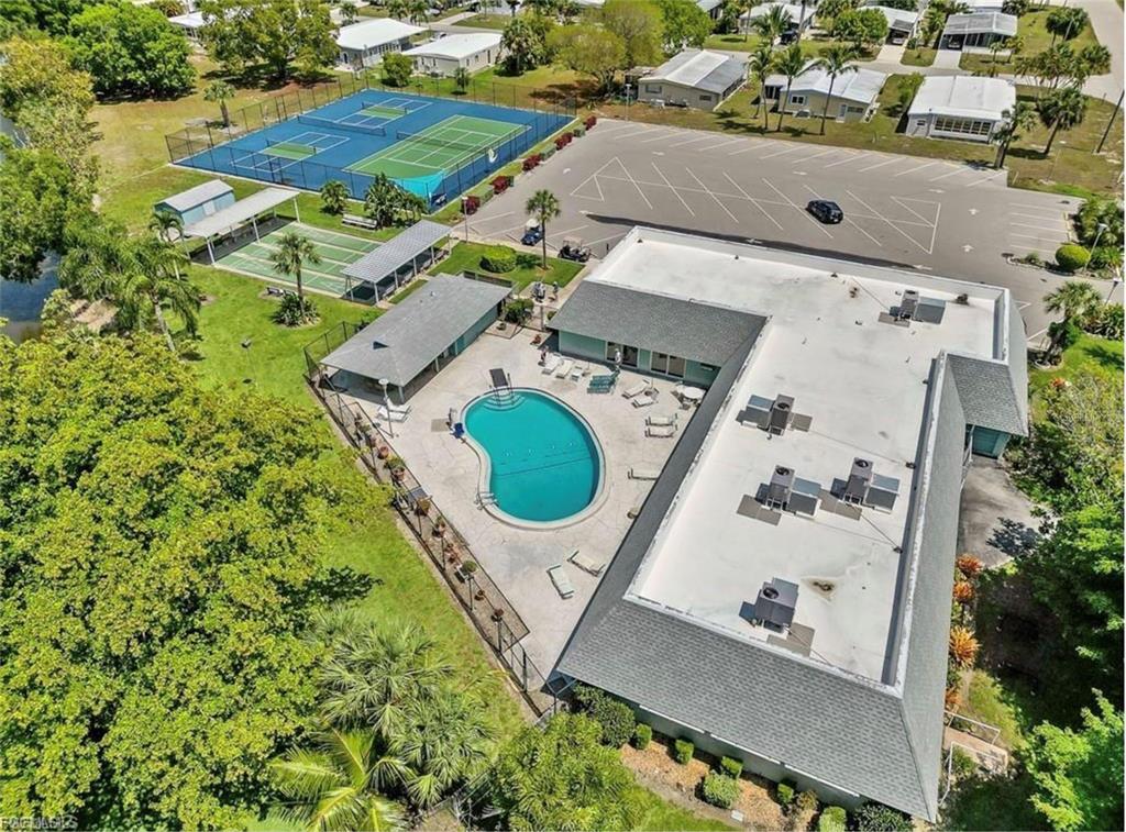 171 Pine Key Lane, Unit 28 Naples, FL 34114 - Photo 7 of 8 an aerial view of residential house with outdoor space and parking