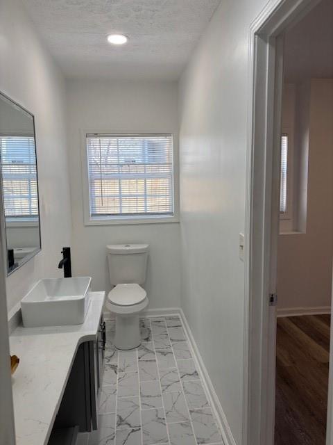1076 Grant Way Southeast Atlanta, GA 30315 - Photo 19 of 29 a bathroom with a sink a toilet and a mirror