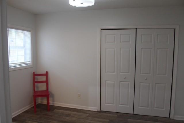1076 Grant Way Southeast Atlanta, GA 30315 - Photo 20 of 29 an empty room with wooden floor and closet
