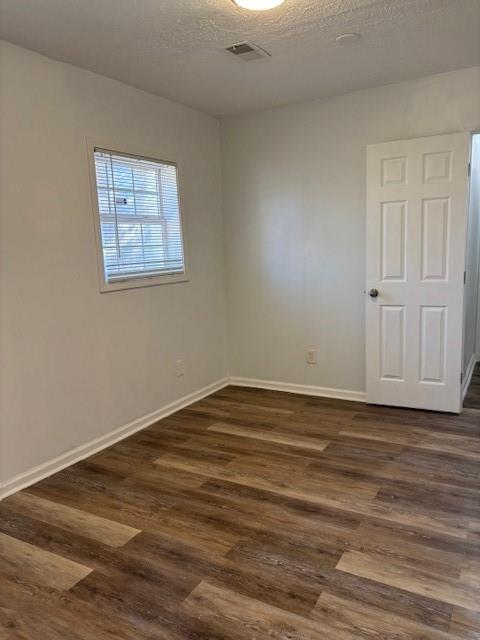 1076 Grant Way Southeast Atlanta, GA 30315 - Photo 23 of 29 a view of an empty room with wooden floor and a window
