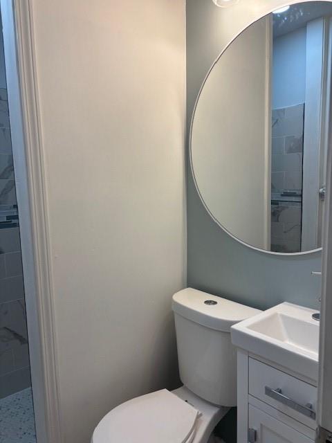 1076 Grant Way Southeast Atlanta, GA 30315 - Photo 24 of 29 a white toilet sitting next to a bathroom sink