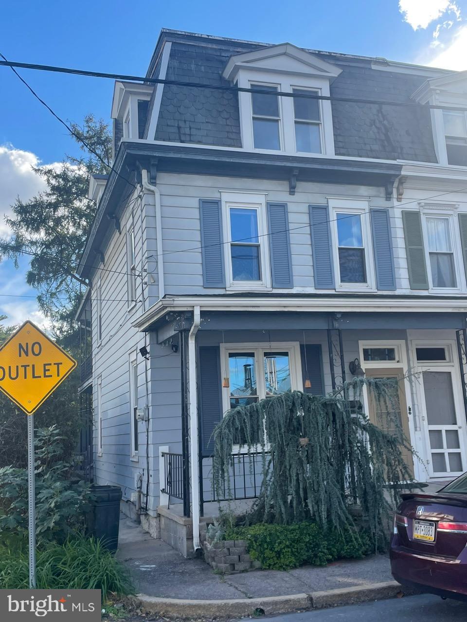 135 Lucknow Road Harrisburg, PA 17110 - Photo 2 of 37 a view of a brick house with many windows and plants