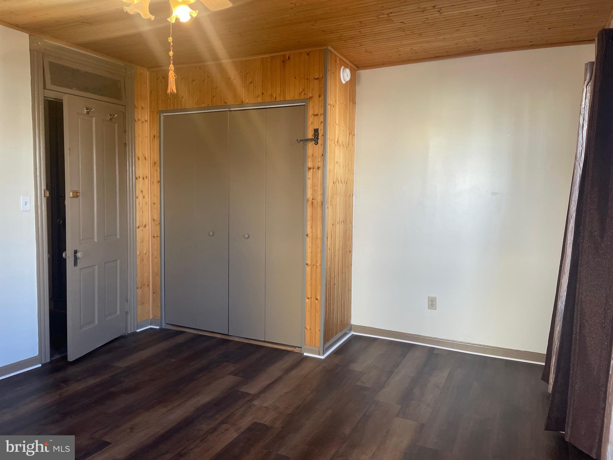 135 Lucknow Road Harrisburg, PA 17110 - Photo 23 of 37 an empty room with wooden floor and closet