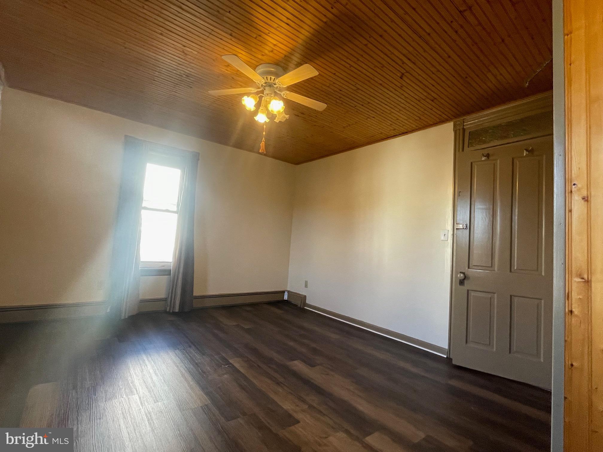 135 Lucknow Road Harrisburg, PA 17110 - Photo 24 of 37 an empty room with wooden floor and windows