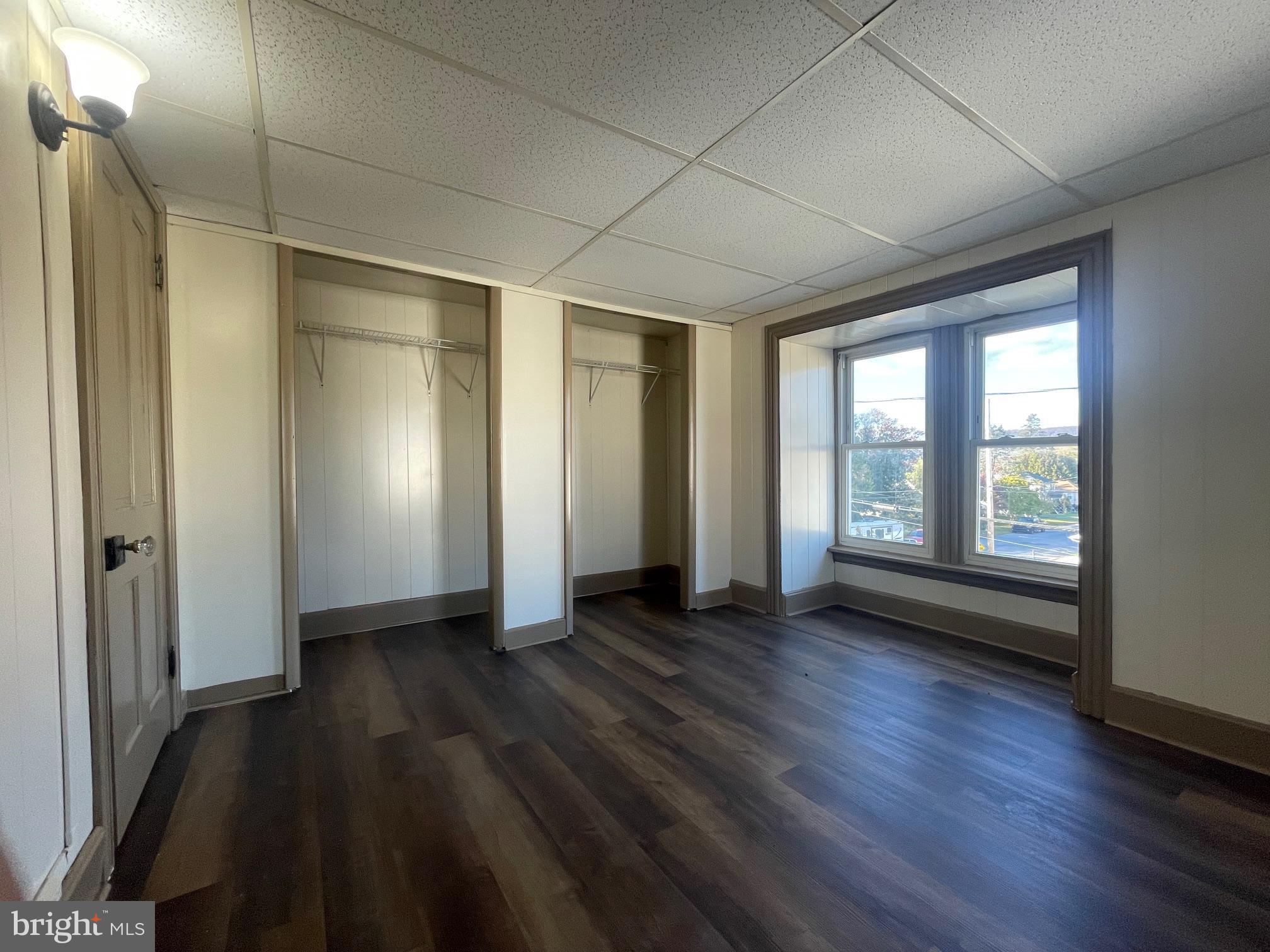135 Lucknow Road Harrisburg, PA 17110 - Photo 35 of 37 an empty room with wooden floor and windows