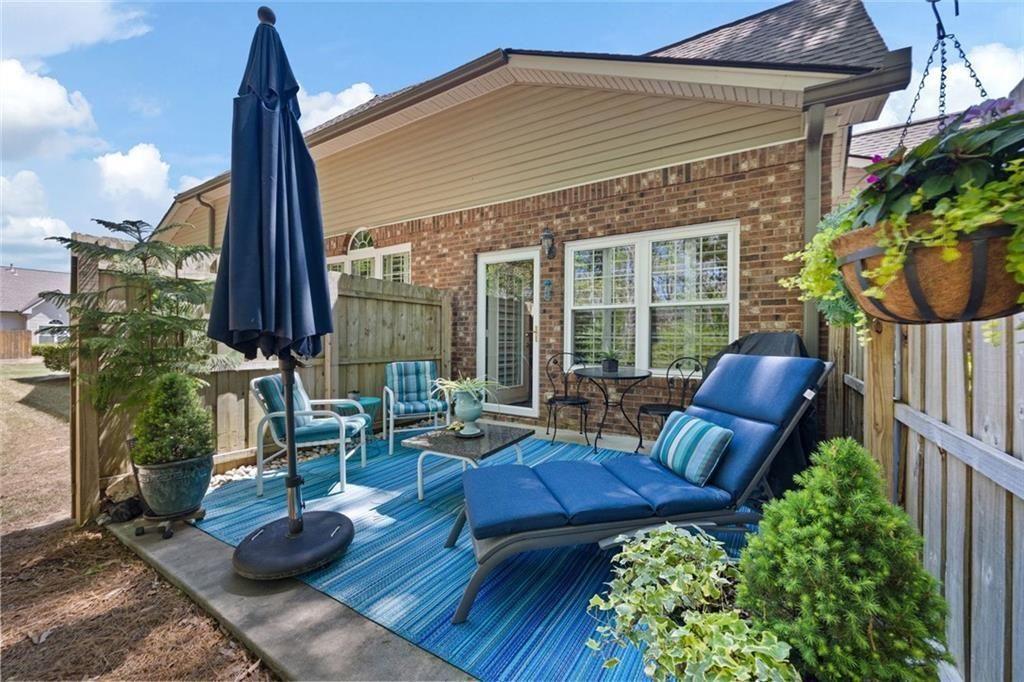3236 Abbott Drive Southwest, Unit 8 Powder Springs, GA 30127 - Photo 14 of 34 a view of a chairs and tables in the patio