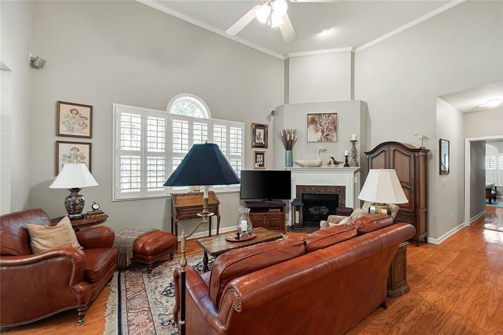 3236 Abbott Drive Southwest, Unit 8 Powder Springs, GA 30127 - Photo 4 of 34 a living room with furniture a fireplace and a window