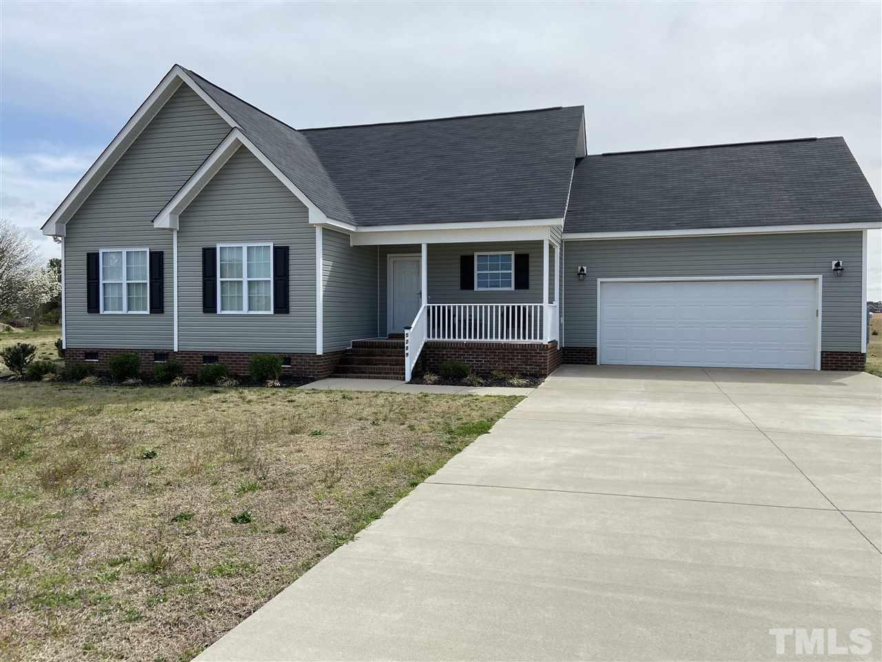 5289 Needham Road Bailey, NC 27807 - Photo 1 of 10 a front view of a house with a yard and garage