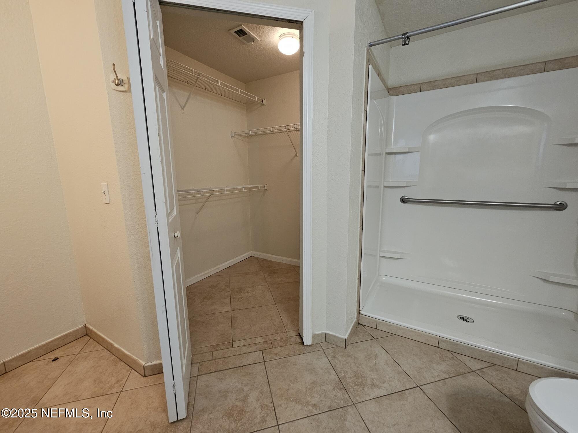 8550 Touchton Road, Unit 218 Jacksonville, FL 32216 - Photo 13 of 25 mstr walk-in closet