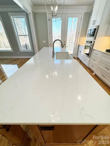 a bathroom with a sink and cabinets