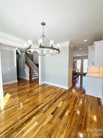 a view of a room with window and wooden floor