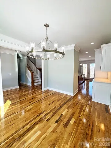 a view of a room with window and wooden floor