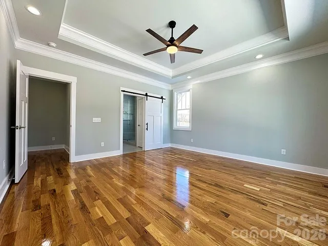a view of a livingroom with wooden floor and closet