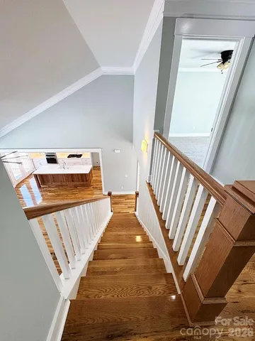 a living room with chairs and a table