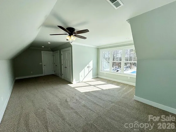 a bedroom with a bed and cabinets