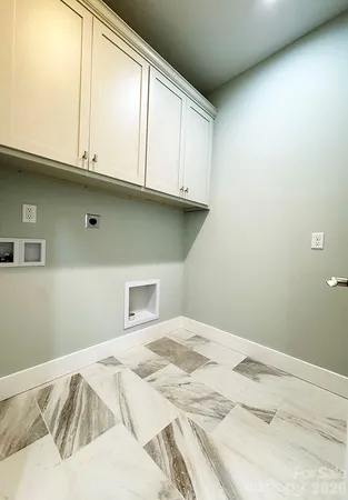 a bathroom with a sink toilet and a mirror