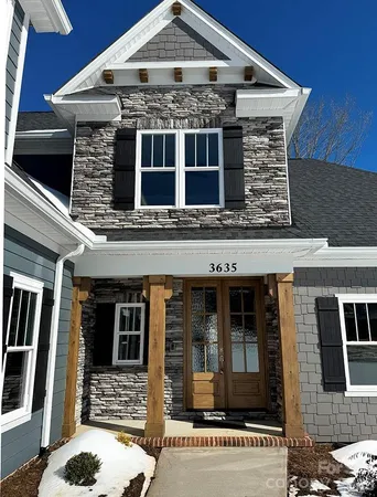 a front view of a house with a porch