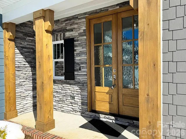 a view of a door and brick wall