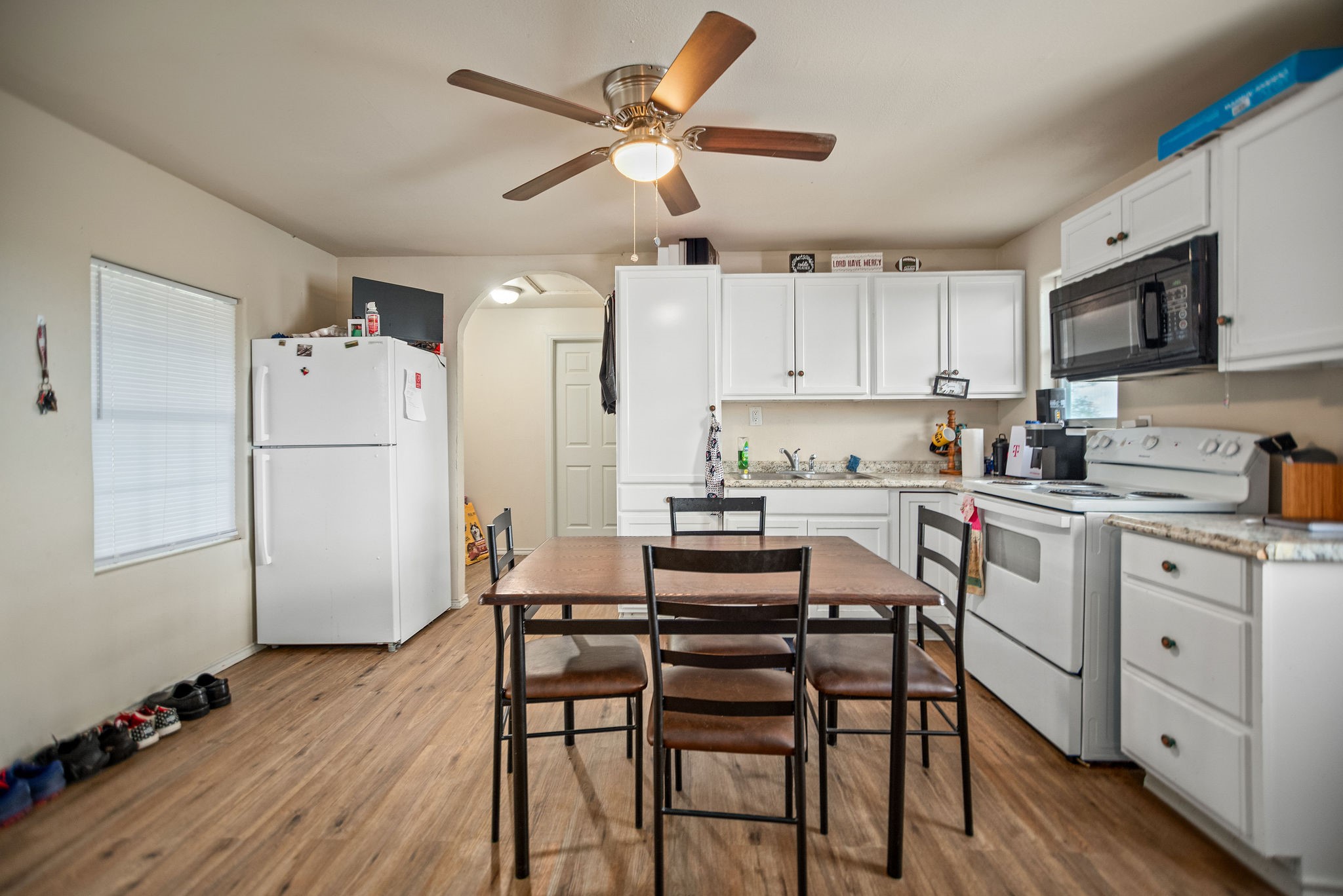 190 Hood Road Inez, TX 77968 - Photo 23 of 29 a kitchen with a refrigerator a white table and chairs