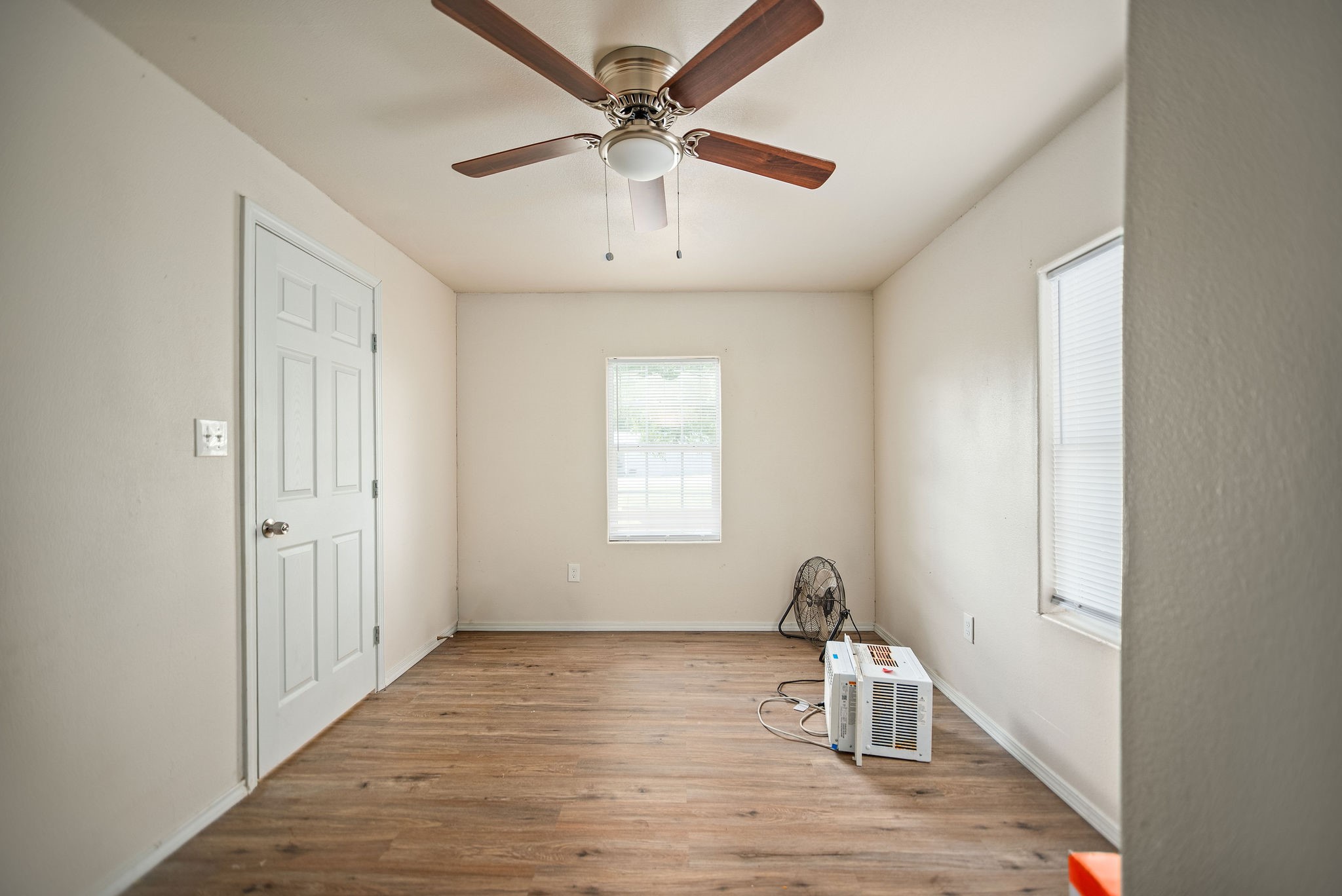 190 Hood Road Inez, TX 77968 - Photo 26 of 29 a room that has a window and a wooden floor