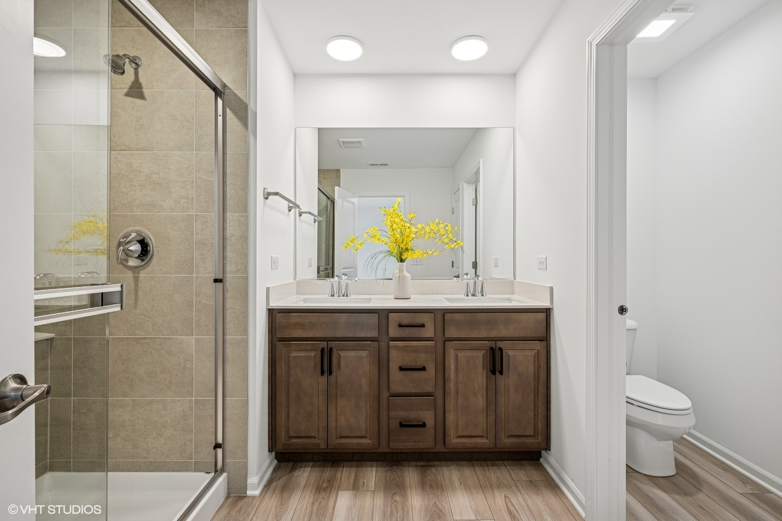 1204 Neubauer Circle, Unit 1304 Lindenhurst, IL 60046 - Photo 12 of 29 a bathroom with a granite countertop sink a toilet and shower