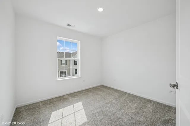 a bathroom with a sink vanity mirror and toilet