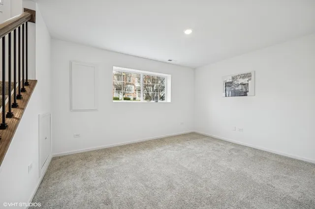 a view of entryway with wooden floor and stairs
