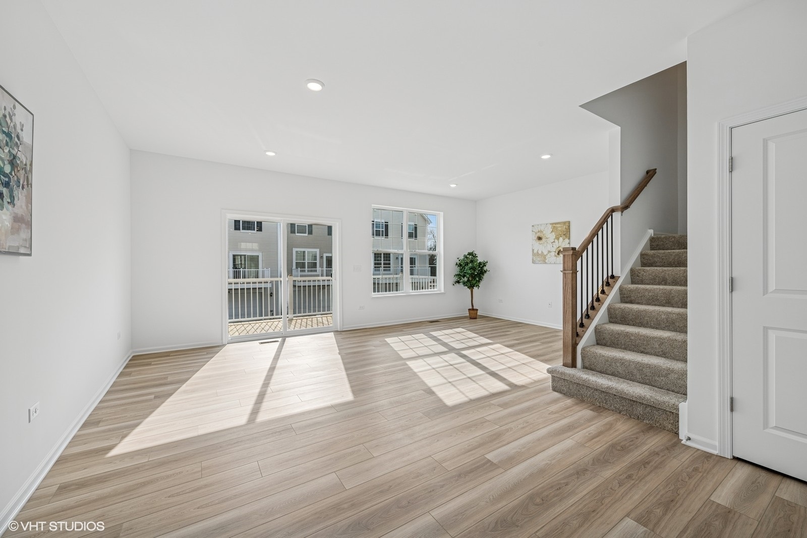 1204 Neubauer Circle, Unit 1304 Lindenhurst, IL 60046 - Photo 4 of 29 a view of an empty room with wooden floor and stairs