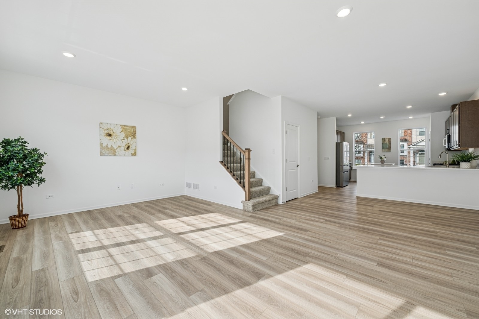 1204 Neubauer Circle, Unit 1304 Lindenhurst, IL 60046 - Photo 5 of 29 a view of a livingroom with wooden floor and a staircase
