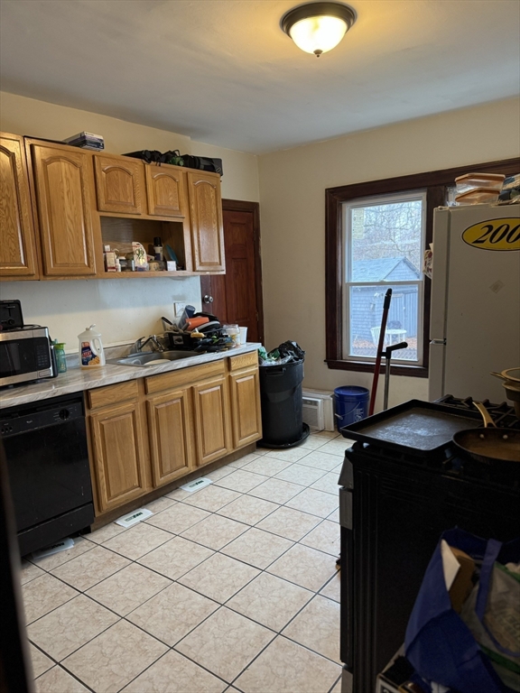 75-77 Belnel Road Boston, MA 02136 - Photo 13 of 23 a kitchen with a sink appliances and cabinets