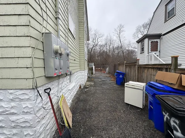 a view of an outdoor sitting area with brick walls