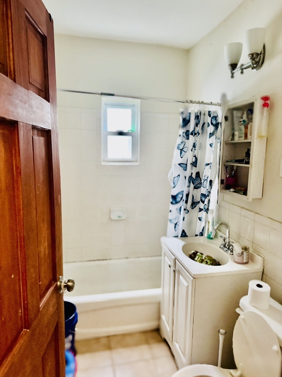 75-77 Belnel Road Boston, MA 02136 - Photo 17 of 23 a bathroom with a sink a toilet and shower
