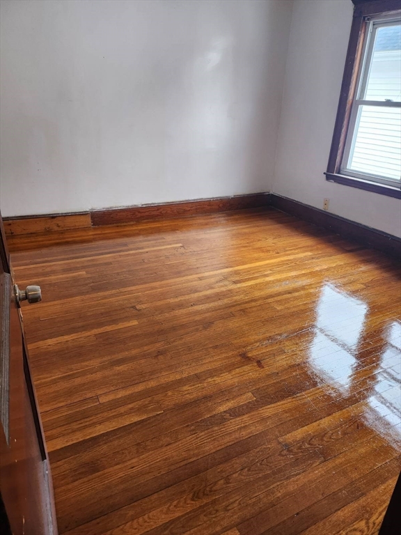 75-77 Belnel Road Boston, MA 02136 - Photo 6 of 23 a view of an empty room with a window