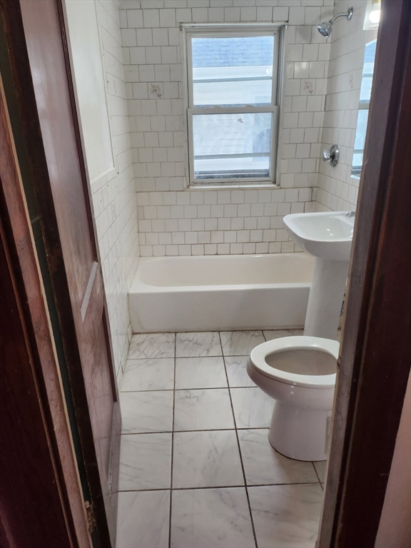 75-77 Belnel Road Boston, MA 02136 - Photo 8 of 23 a bathroom with a toilet a sink a mirror and bathtub