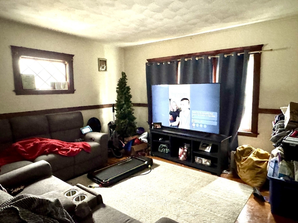 75-77 Belnel Road Boston, MA 02136 - Photo 9 of 23 a living room with furniture