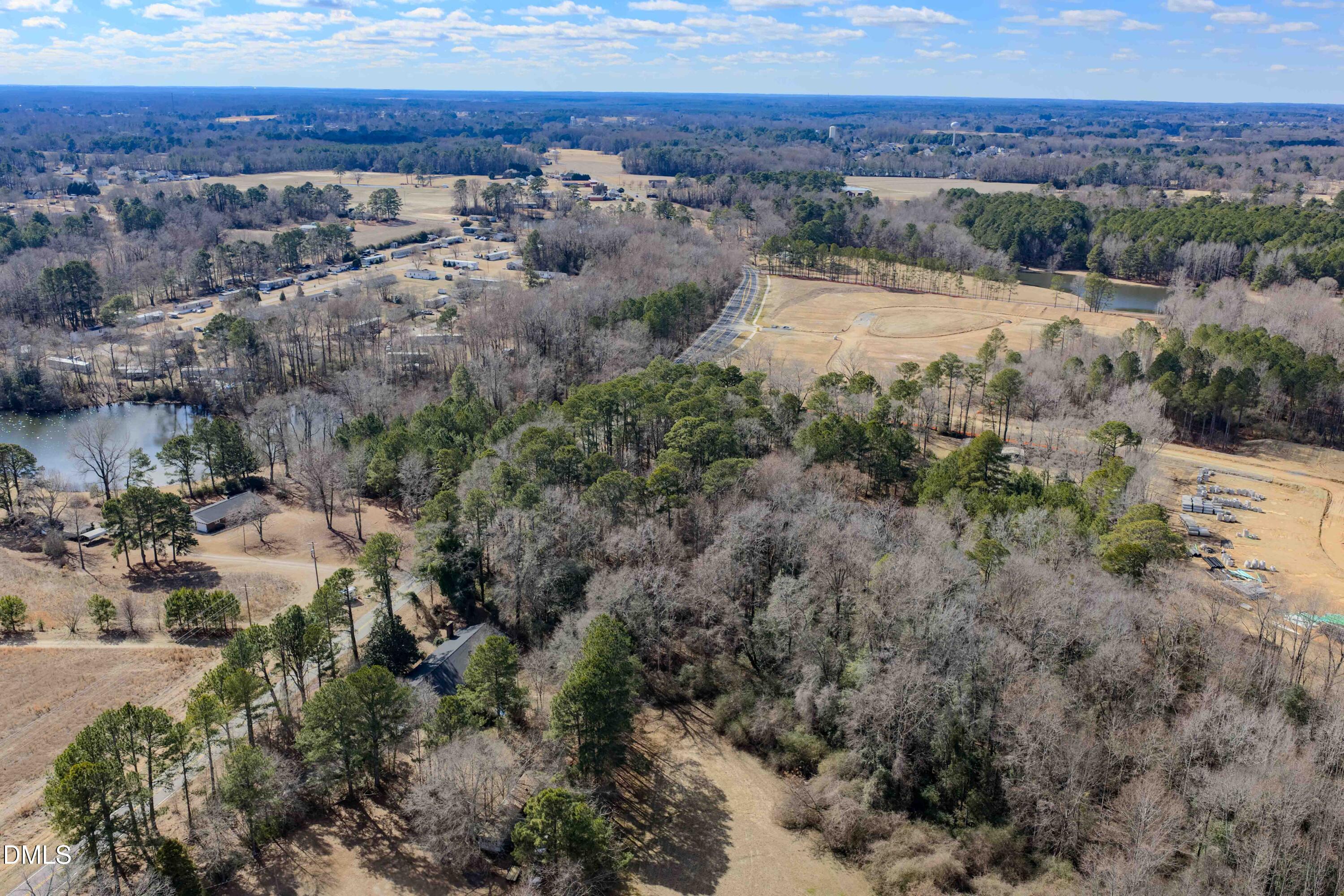6724 Wimberly Road Willow Spring, NC 27592 - Photo 11 of 36 a view of a houses with a yard